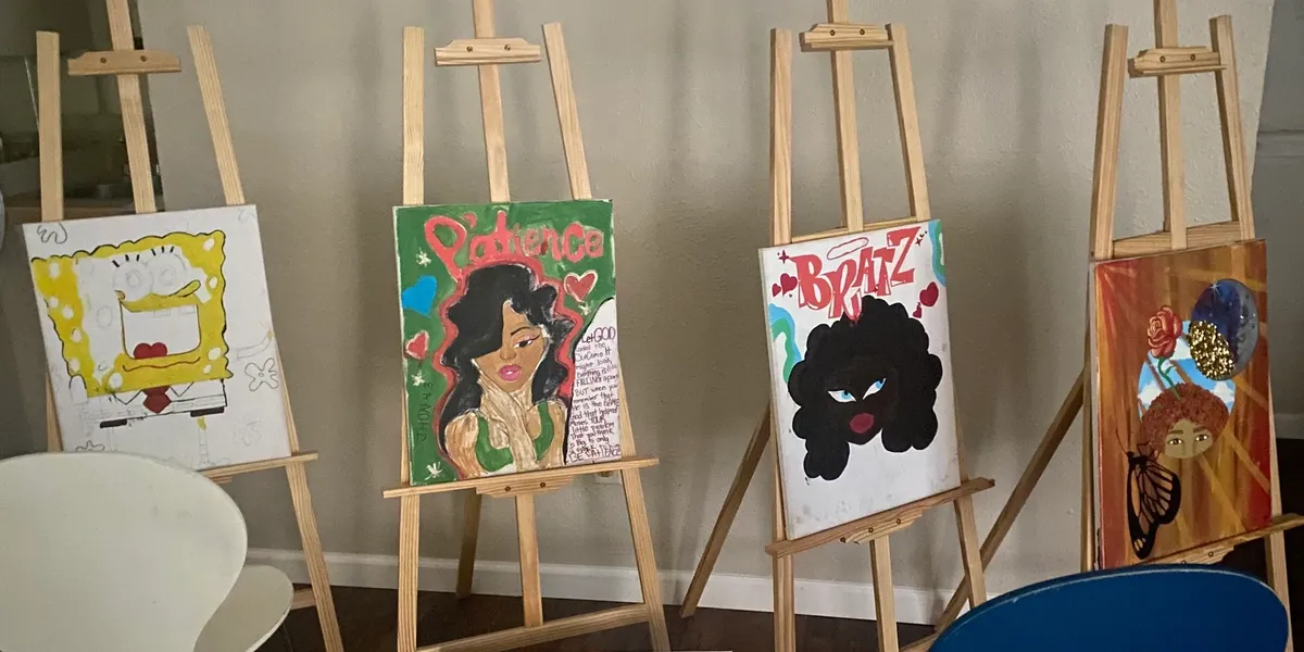 Teens participating in art therapy painting session